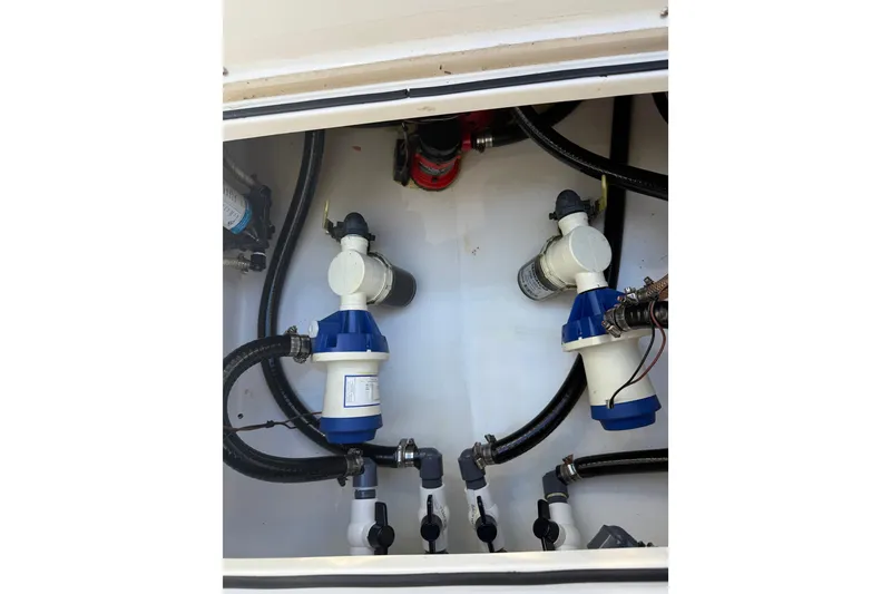 Slide: The Image of 2022 Dorado 25 Flat Deck boat plumbing system with hoses and valves. - 61