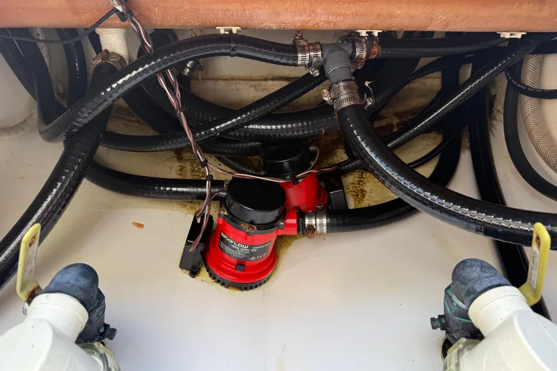 Slide: The Image of Bilge pump system in 2022 Dorado 25 Flat Deck boat, featuring hoses and connectors. - 63