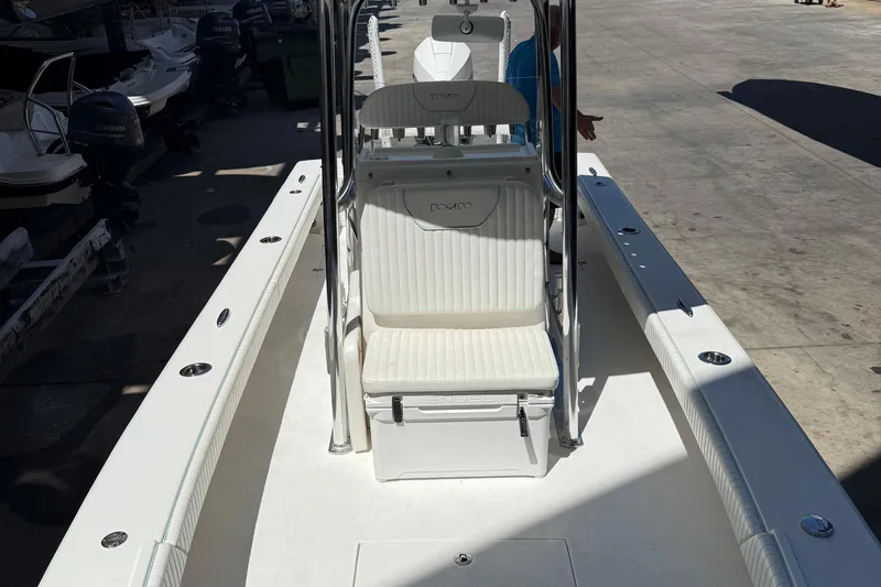Slide: The Image of 2022 Dorado 25 Flat Deck boat with seating and console, docked outdoors. - 68