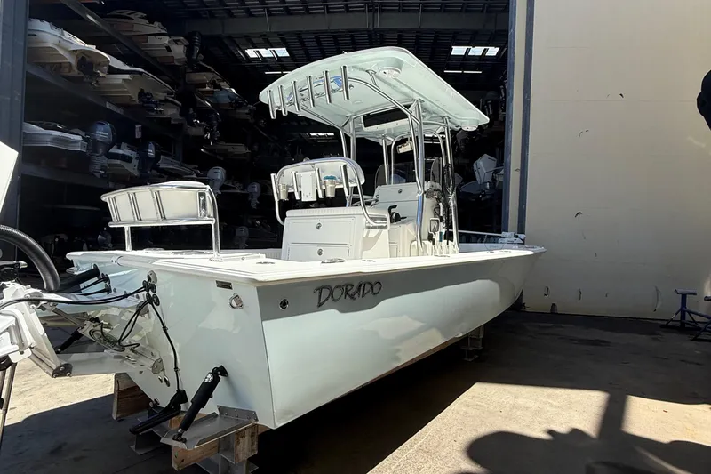 Slide: The Image of 2022 Dorado 25 Flat Deck boat in storage, featuring sleek design and modern equipment. - 7