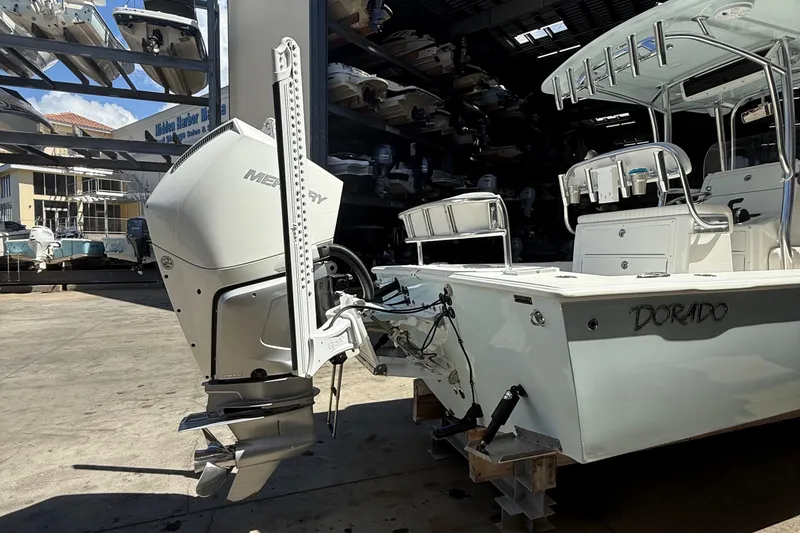 Slide: The Image of 2022 Dorado 25 Flat Deck boat with Mercury outboard motor in storage facility. - 8