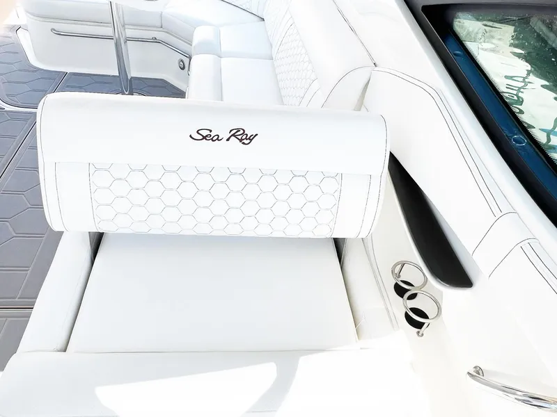 Slide: The Image of 2019 Sea Ray Sundancer 320 Outboard, white leather seating with hexagonal stitching detail. - 11