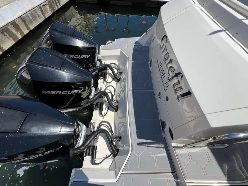 Slide: The Image of 2019 Sea Ray Sundancer 320 Outboard with triple Mercury engines docked at marina. - 12