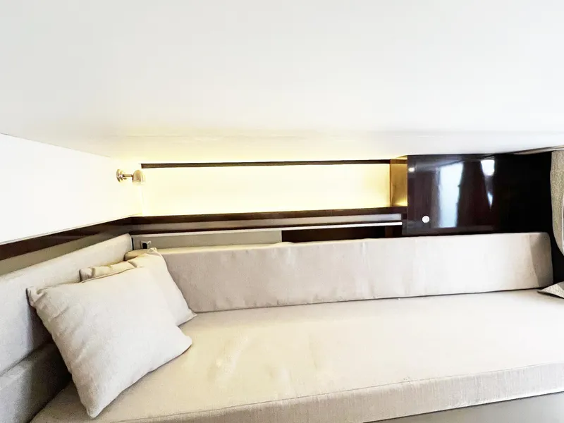 Slide: The Image of Interior cabin of 2019 Sea Ray Sundancer 320 Outboard with beige seating and modern design. - 22