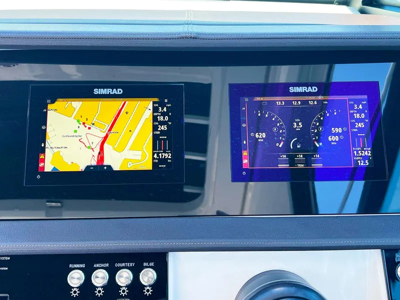 Slide: The Image of Simrad navigation displays on 2019 Sea Ray Sundancer 320 Outboard dashboard. - 27