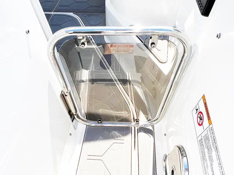 Slide: The Image of 2019 Sea Ray Sundancer 320 Outboard boat door with stainless steel frame and safety warnings. - 34