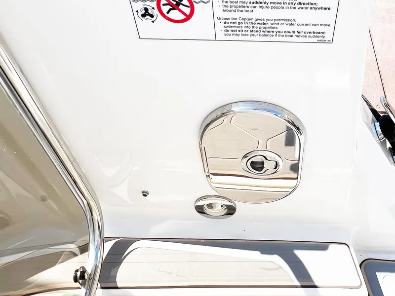 Slide: The Image of 2019 Sea Ray Sundancer 320 Outboard boat detail with chrome fixture and safety instructions. - 36
