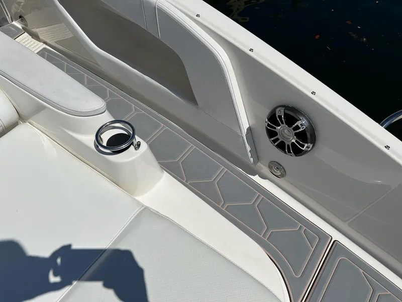 Slide: The Image of 2019 Sea Ray Sundancer 320 Outboard interior with cup holder and speaker detail. - 37