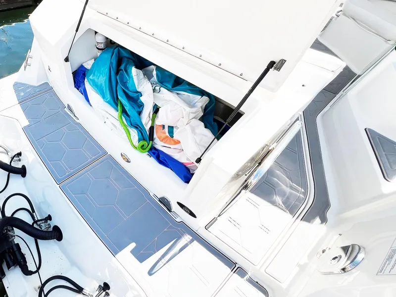 Slide: The Image of 2019 Sea Ray Sundancer 320 Outboard storage compartment with colorful gear and accessories. - 41
