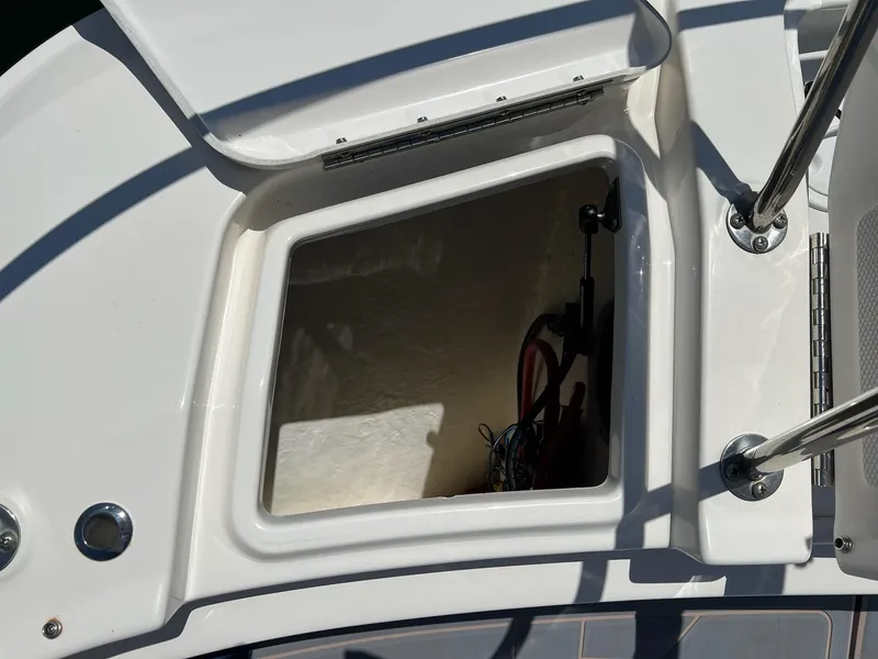 Slide: The Image of 2019 Sea Ray Sundancer 320 Outboard storage compartment, open hatch view. - 44