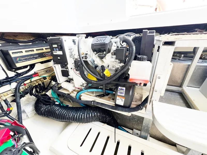 Slide: The Image of Engine compartment of 2019 Sea Ray Sundancer 320 Outboard with visible components and wiring. - 48