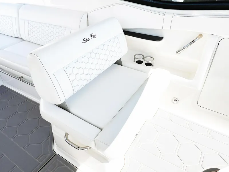 Slide: The Image of Luxurious seating on 2019 Sea Ray Sundancer 320 Outboard with elegant white upholstery. - 9