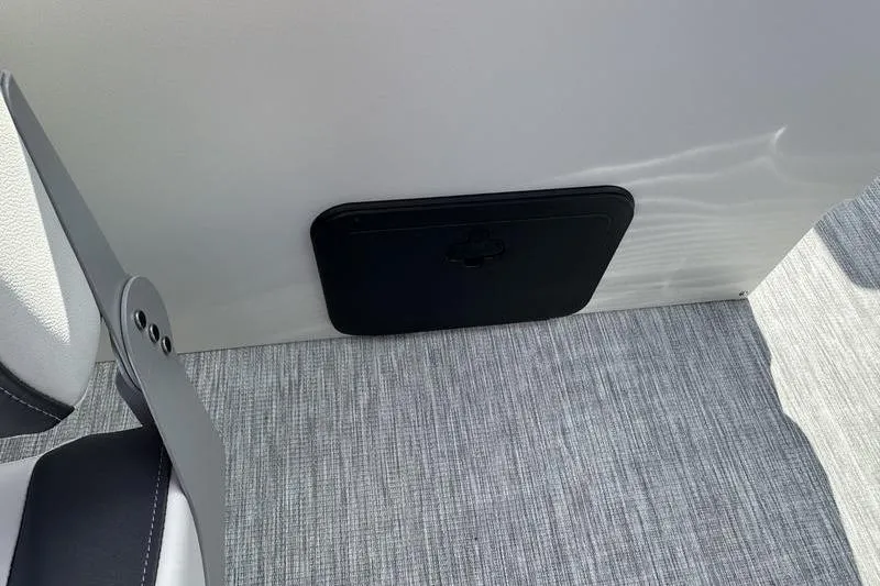 Slide: The Image of 2026 Bennington S 20 SF pontoon boat in a parking lot under a cloudy sky. - 11