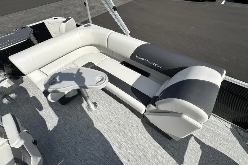 Slide: The Image of 2026 Bennington S 20 SF boat model emblem on sleek black surface. - 14