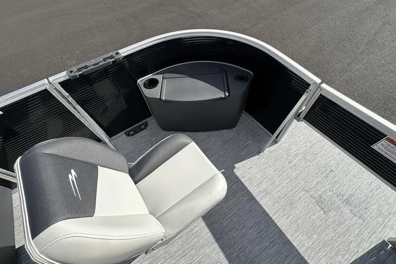 Slide: The Image of 2026 Bennington S 20 SF pontoon boat interior with seating and steering console. - 18
