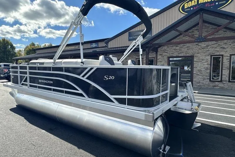 Slide: The Image of 2026 Bennington S 20 SF boat interior with cup holders and storage compartment. - 34