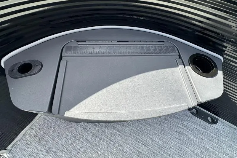 Slide: The Image of 2026 Bennington S 20 SF boat console with cup holders and integrated ruler. - 35