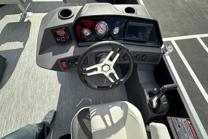 Slide: The Image of 2026 Bennington S 20 SF boat dashboard with steering wheel and control panel. - 36