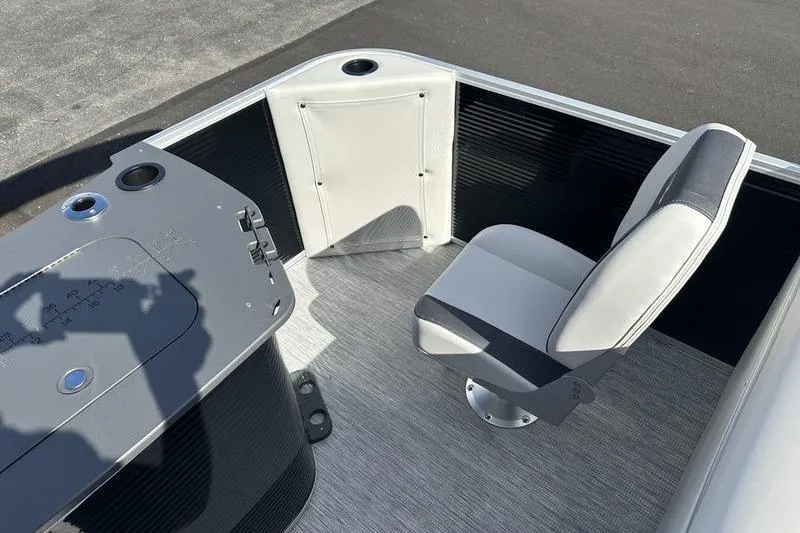 Slide: The Image of 2026 Bennington S 20 SF pontoon boat under a partly cloudy sky. - 5