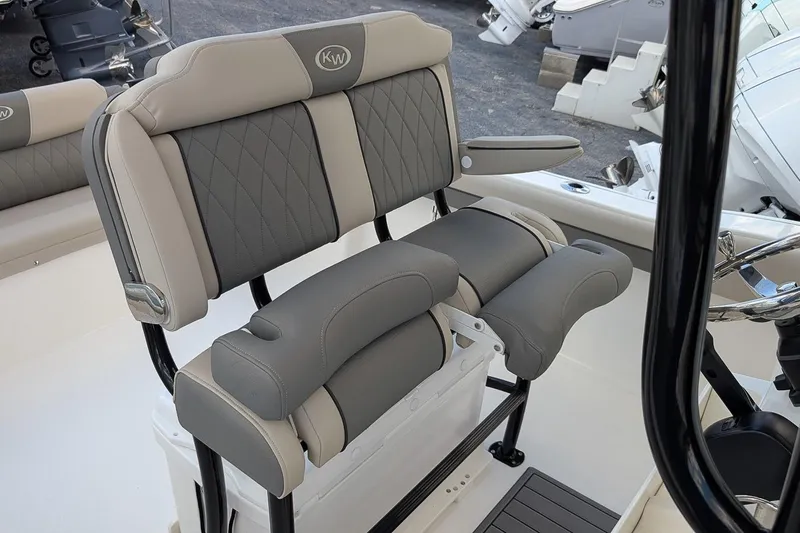 Slide: The Image of 2025 Key West 239 FS boat seating with gray and beige cushioned design. - 14