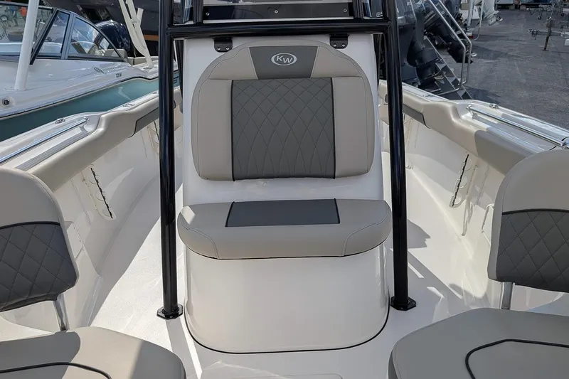 Slide: The Image of 2025 Key West 239 FS boat interior with gray seating and sleek design. - 17