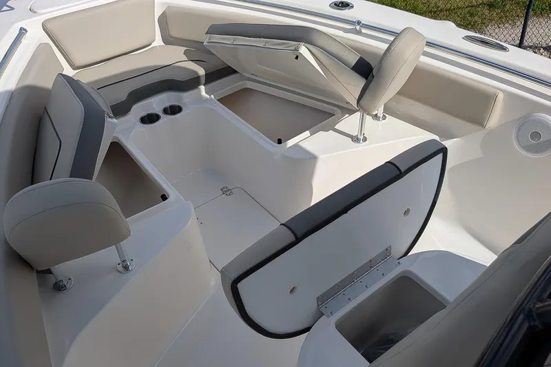 Slide: The Image of 2025 Key West 239 FS boat interior with seating and storage compartments. - 19
