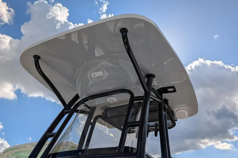 Slide: The Image of 2025 Key West 239 FS boat top against a blue sky with clouds. - 22
