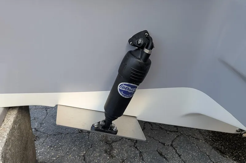 Slide: The Image of Trim tab on 2025 Key West 239 FS boat, featuring Bennett hydraulic actuator. - 4