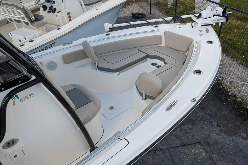 Slide: The Image of 2025 Key West 239 FS boat interior with seating and Garmin equipment. - 8