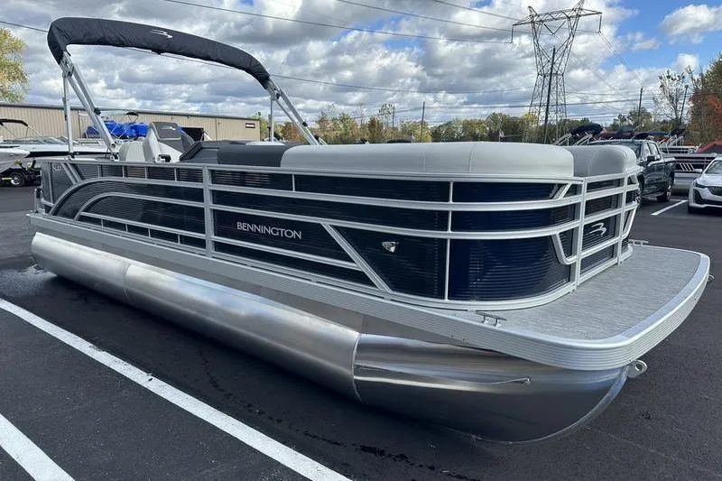 Slide: The Image of 2026 Bennington 22 SF boat with "S22" emblem on blue surface. - 10