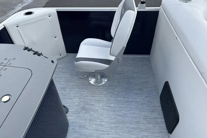 Slide: The Image of 2026 Bennington 22 SF boat interior with swivel chair and control panel. - 17