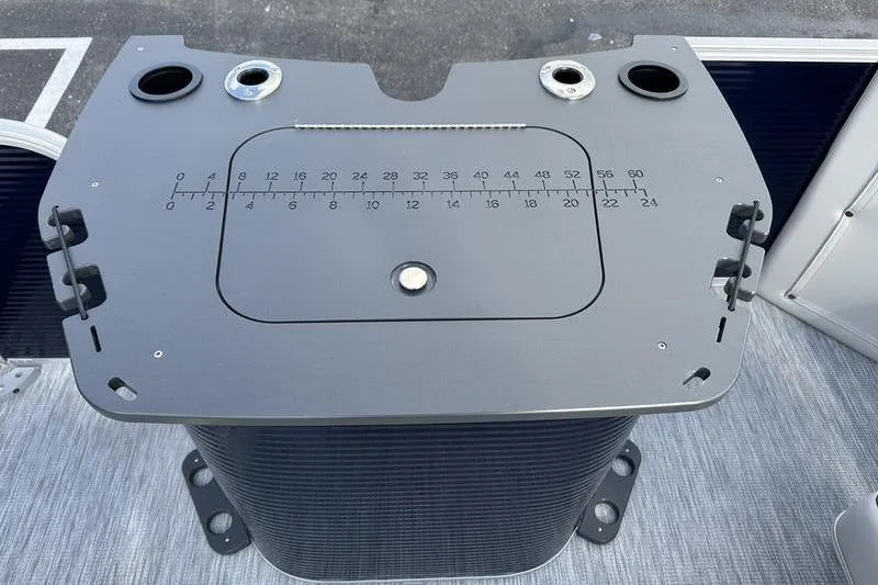 Slide: The Image of 2026 Bennington 22 SF boat console with measurement markings and cup holders. - 18