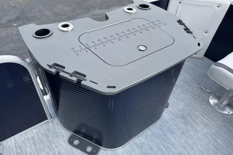 Slide: The Image of Bennington 22 SF 2026 boat console with integrated measurement scale and cup holders. - 21