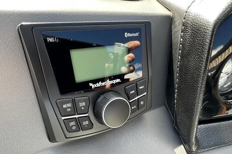 Slide: The Image of Garmin display on 2026 Bennington 22 SF boat dashboard, showing control buttons. - 28