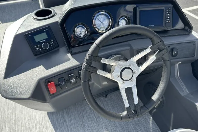 Slide: The Image of 2026 Bennington 22 SF boat interior with gray and white seating on textured flooring. - 29