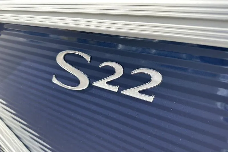 Slide: The Image of 2026 Bennington 22 SF pontoon boat interior with gray and white seating and table. - 9