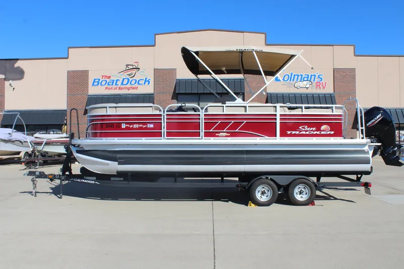 The Image of 2023 Sun Tracker Party Barge 22 RF DLX pontoon boat on trailer at dealership. - 0