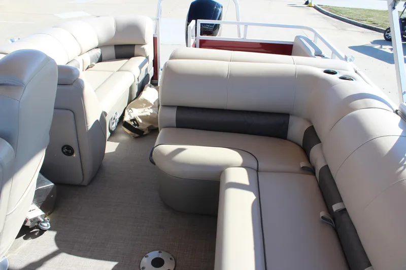 Slide: The Image of 2023 Sun Tracker Party Barge 22 RF DLX interior with plush seating and cup holders. - 10