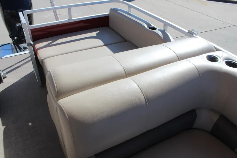 Slide: The Image of 2023 Sun Tracker Party Barge 22 RF DLX with beige seating and cup holders. - 12