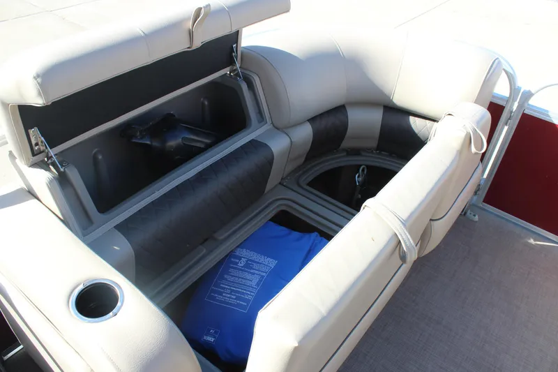 Slide: The Image of 2023 Sun Tracker Party Barge 22 RF DLX storage compartment with seating and cup holder. - 20
