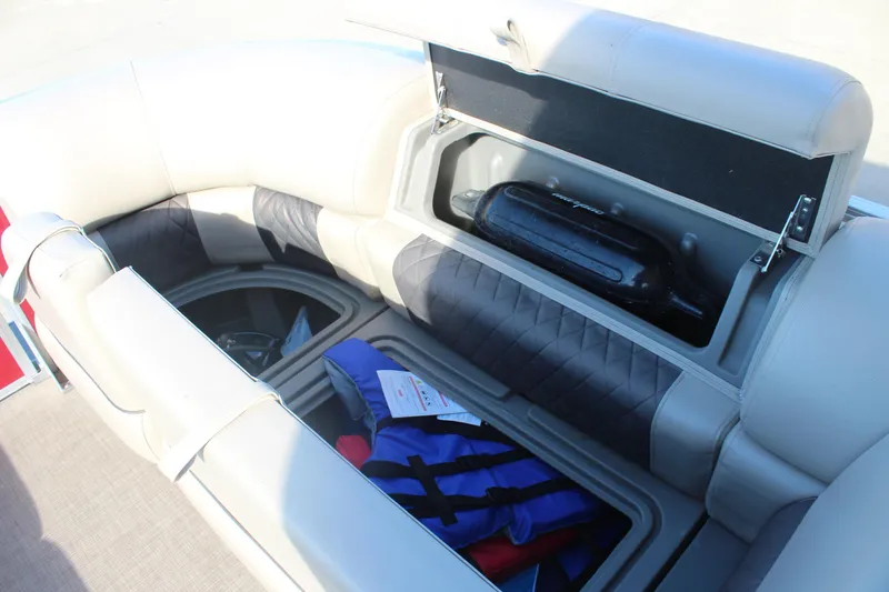 Slide: The Image of 2023 Sun Tracker Party Barge 22 RF DLX interior storage with life jackets and fender. - 21