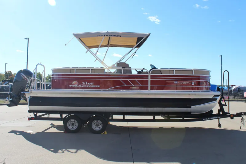 Slide: The Image of 2023 Sun Tracker Party Barge 22 RF DLX pontoon boat on trailer. - 4