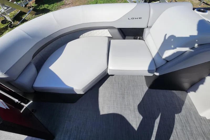 Slide: The Image of 2026 Lowe SS 230 DV boat interior with sleek, modern seating design. - 12