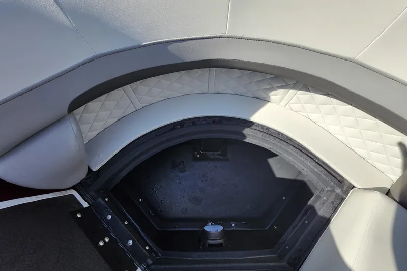 Slide: The Image of Interior of 2026 Lowe SS 230 DV boat with storage compartment and quilted seating. - 14