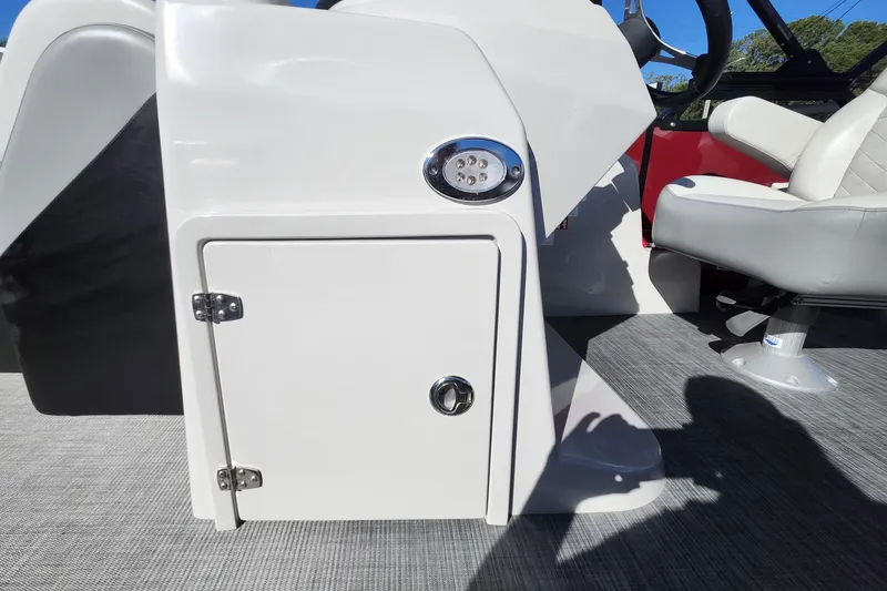 Slide: The Image of 2026 Lowe SS 230 DV boat interior with white console and seating. - 16