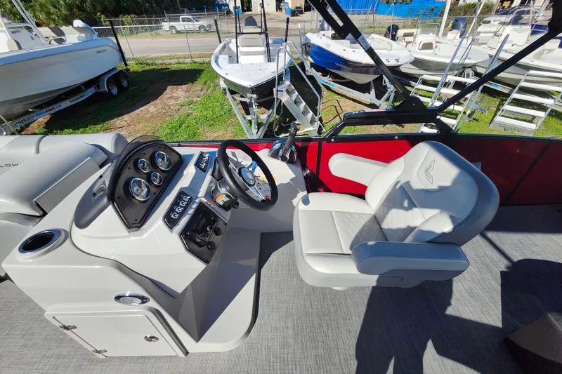 Slide: The Image of 2026 Lowe SS 230 DV boat interior with steering console and captain's chair. - 18