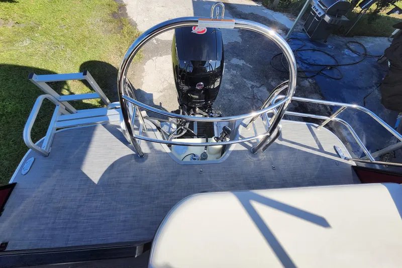 Slide: The Image of 2026 Lowe SS 230 DV boat with outboard motor and stainless steel railing. - 29