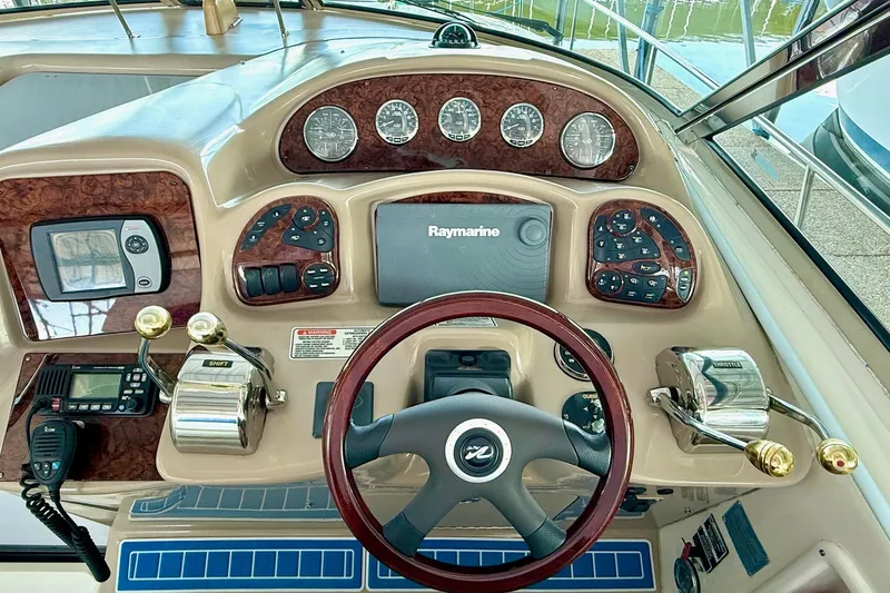 Slide: The Image of 2005 Sea Ray 340 Sundancer helm with Raymarine display and control panel. - 18