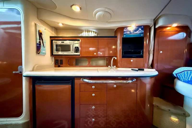Slide: The Image of Luxurious 2005 Sea Ray 340 Sundancer yacht interior with modern kitchen amenities. - 25