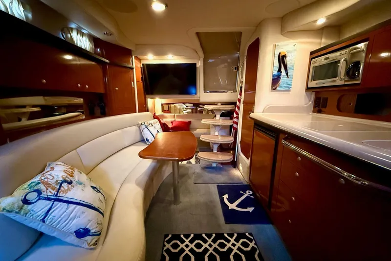 Slide: The Image of Luxurious interior of 2005 Sea Ray 340 Sundancer yacht with elegant seating and modern amenities. - 27